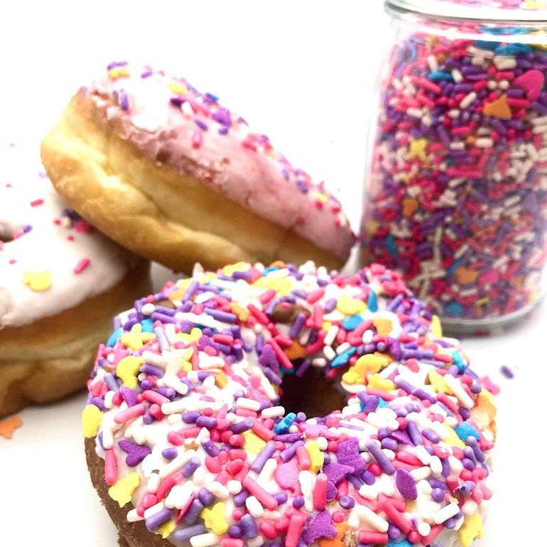 Freshly decorated sprinkle donuts at The Donut Run